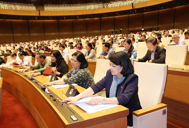 National Assembly deputies vote on amendments to the immigration law on Monday.