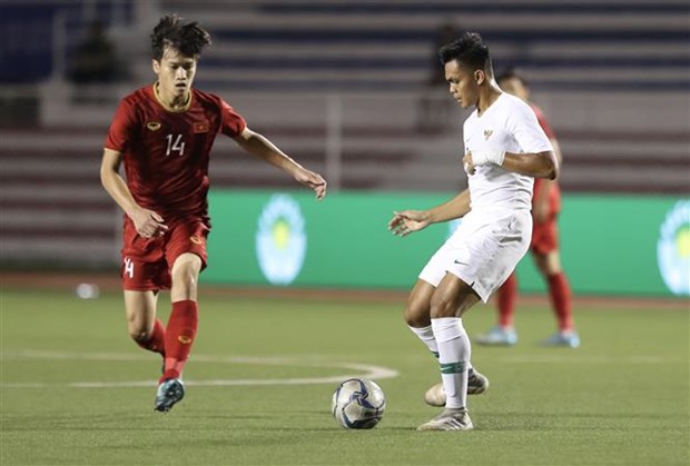 Nguyen Hoang Duc (in red) in action (Photo: VNA)