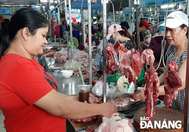 A pork selling stand at the Moi Market