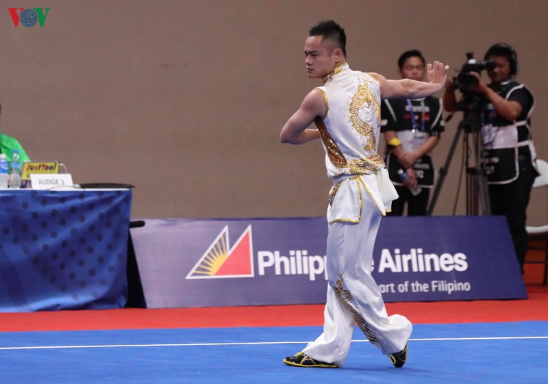 Phạm Quốc Khánh giành HCV đầu tiên cho Wushu Việt Nam ở SEA Games 30. (Ảnh: Ngọc Duy)