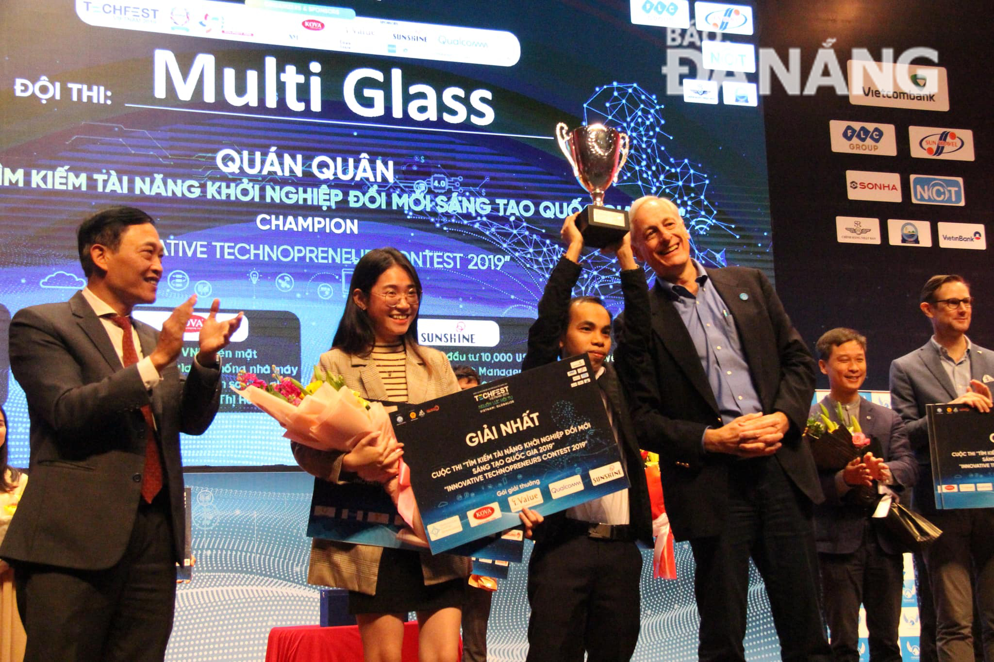 Mr Le Hoang Anh (holding trophy) is the founder of the MultiGlass project