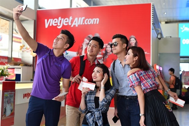 Vietjet's passengers pose for a photo before boarding a flight (Photo courtesy of Vietjet)