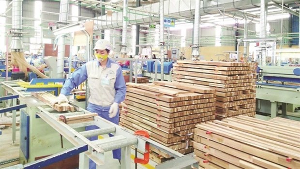 At a wood processing plant. Foreign investment in the wood processing industry in Vietnam has increased significantly in recent years. (Photo: VNA/VNS)