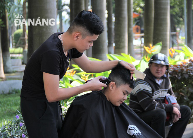 A pupil receiving free haircut