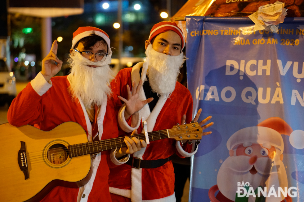 Young men being dressed up as Santa Clauses to deliver heart-warming Christmas gifts to kids