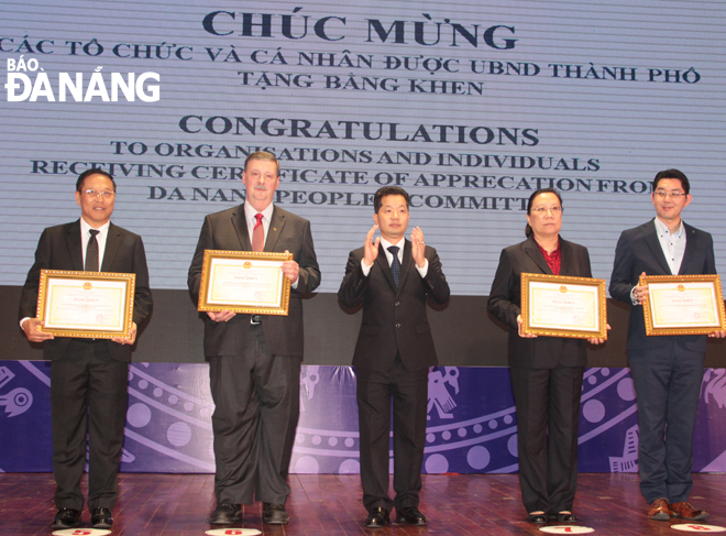 Deputy Secretary Quang (centre) with some of the honourees