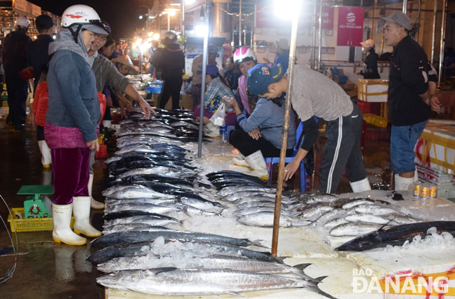 Different types of fish are on sale at the city's seafood wholesale market