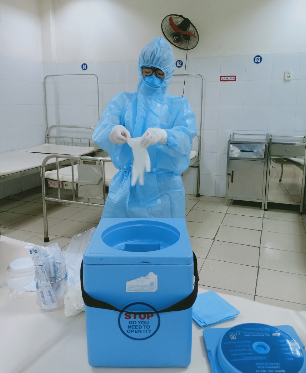 A medical worker from the municipal Centre for Disease Control and Prevention preparing for taking samples of suspected coronavirus patients