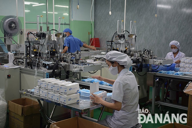 A mask production line at a medical equipment manufacturing factory