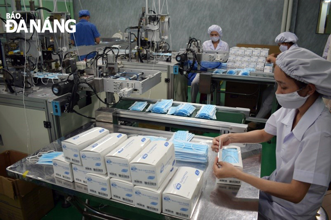 Workers of the medical device plants of the Danameco Medical Joint Stock Corporation in Da Nang and Quang Nam Province are working overtime amid the coronavirus outbreak