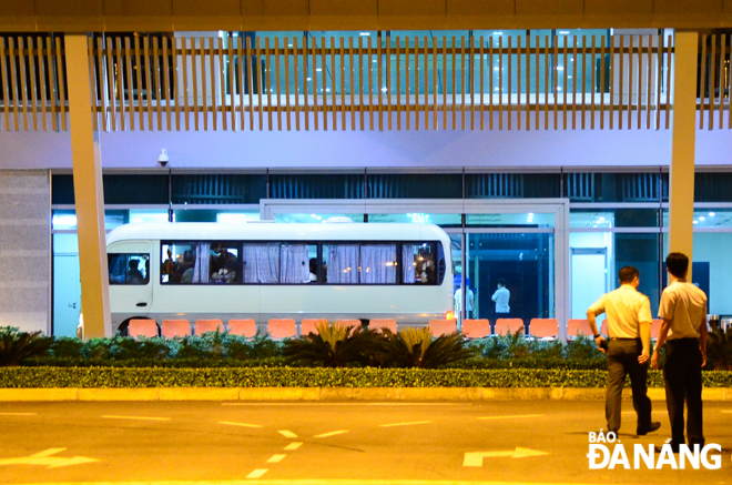 A tourist coach carrying the South Korean nationals stopping in front of the main hall of the guest house