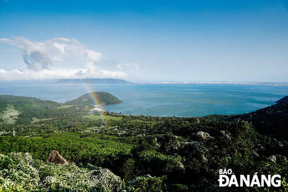 Spectacular views from the pass with white clouds, blue skies and rainbows