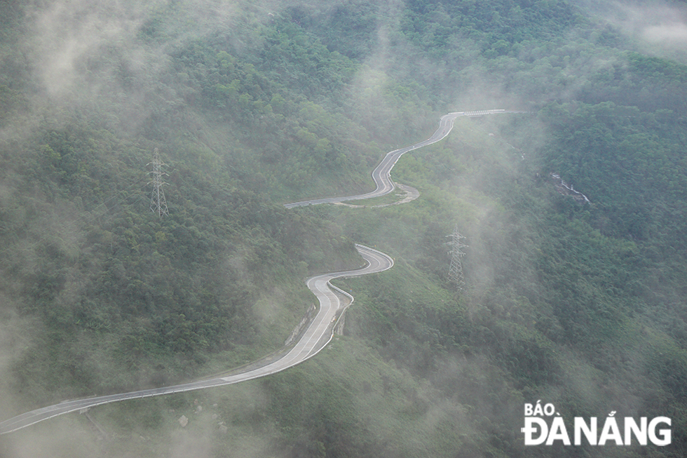 Winding roads looming in the thin veil of morning 