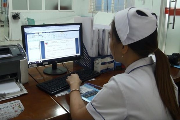 A health care worker inputs patient data into the computing system at Long Khanh General Hospital in Dong Nai province. Health care is one of the sectors that could benefit from online data storage (Photo: VNA)