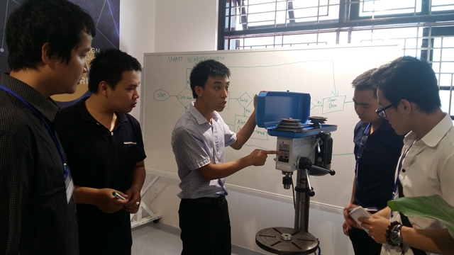 A lecturer and students of the Da Nang University during a practical session at the innovation centre at the university. The College of Technology Science from the university plans to open the first ever Aviation Engineering course for a factory in Da Nang.