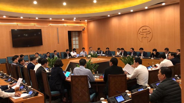 The People's Committee of Ha Noi holds an urgent meeting on March 6 night after receiving reports on the new COVID-19 case (Photo: VNA) 