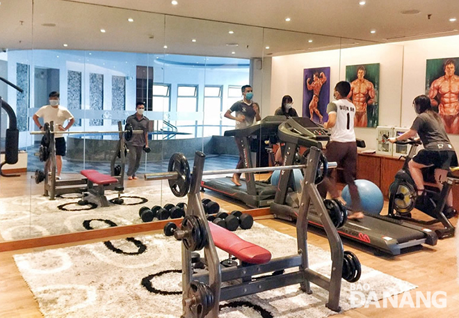 Hotel guests taking physical exercises to improve their health while they are under insolation.  