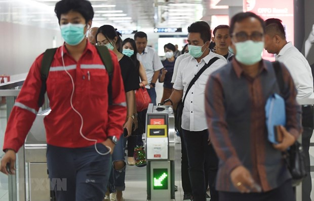 People in Indonesia wear face masks (Photo: Xinhua/VNA)