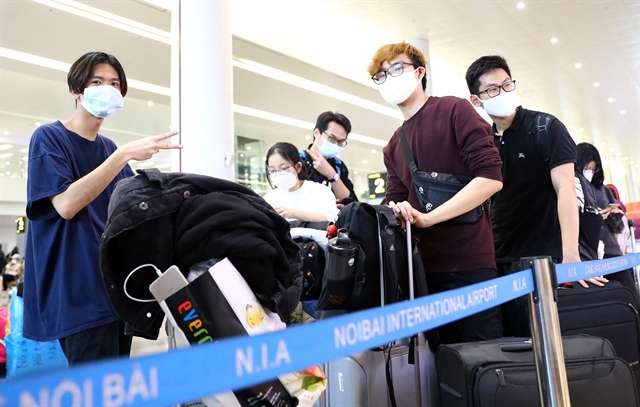 Vietnamese people return to Viet Nam via Noi Bai international airport in Ha Noi