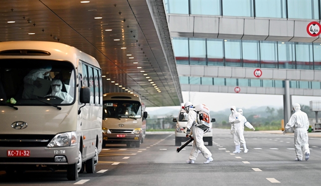 Spraying disinfectant at Van Don international airport in Quang Ninh Province