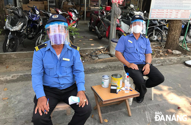 Security guards at the Orthopaedics and Rehabilitation Hospital wearing face shields