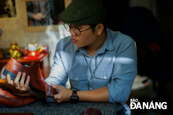 Le Nhu Tham at his Ramleather shop on Thanh Thuy Street