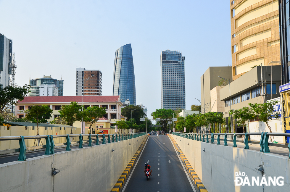 Light traffic moves along the tunnel taking Tran Phu under Le Duan