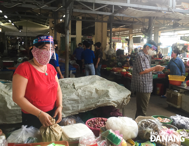 A market stallholder is already using face shields made by the YU members