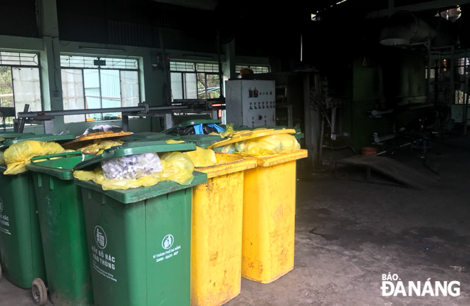  Trash bins are gathered into a place before being put into incinerators in the factory