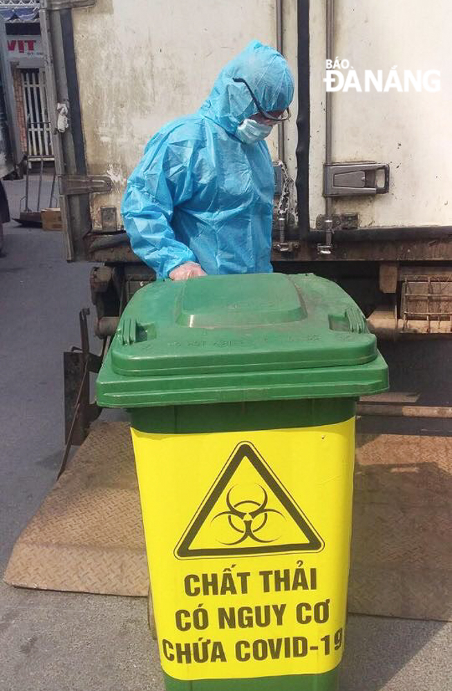 A waste bin is labelled 'infectious medical waste'