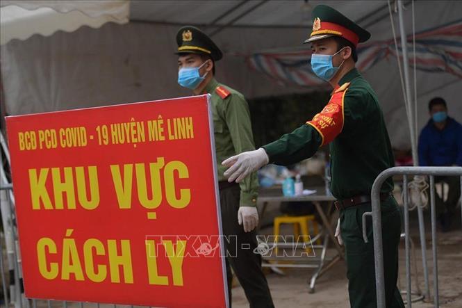 Cách ly y tế tại thôn Hạ Lôi (Mê Linh, Hà Nội). Ảnh: Nguyễn Cúc-TTXVN
