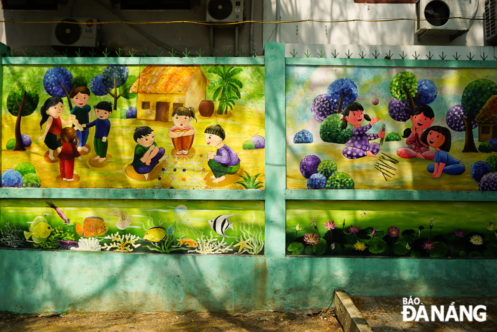 Eye-catching murals painted by teacher Thanh are giving ‘new coats’ to old walls of the school
