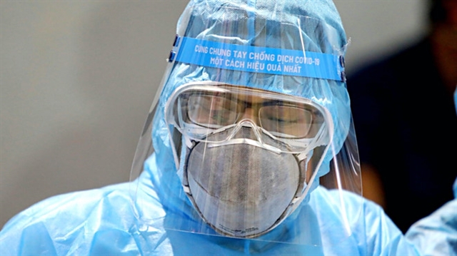 A Vietnamese medical worker in protective clothing.