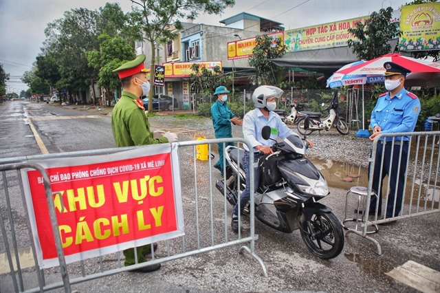 Anyone going in or out of Ha Loi village in Me Linh District District, Ha Noi, must report to the check points set up around the village as it remains a high-risk Covid-19 area with 13 confirmed Covid-19 cases, while social distancing measures are relaxed in most other parts of Ha Noi.