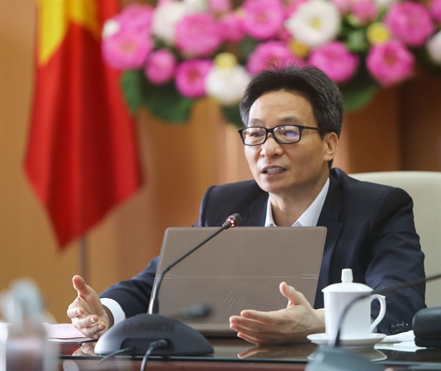 Deputy Prime Minister Vũ Đức Đam speaks at the meeting of the National Steering Committee for Covid-19 Prevention and Control in Ha Noi on Friday.