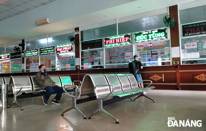 Few passengers can be seen at ticketing counters in the inter-provincial coach station