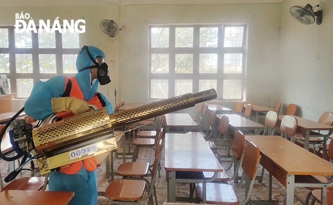 The Hoang Hoa Tham School being disinfected before reopening its doors