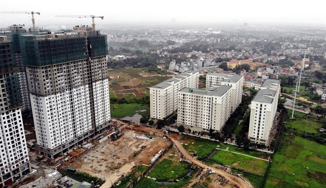 EcoHome housing project under construction in Ha Noi. A number of administration fees in sectors including construction, travel, banking and water resource were cut to support businesses after the Covid-19 pandemic.