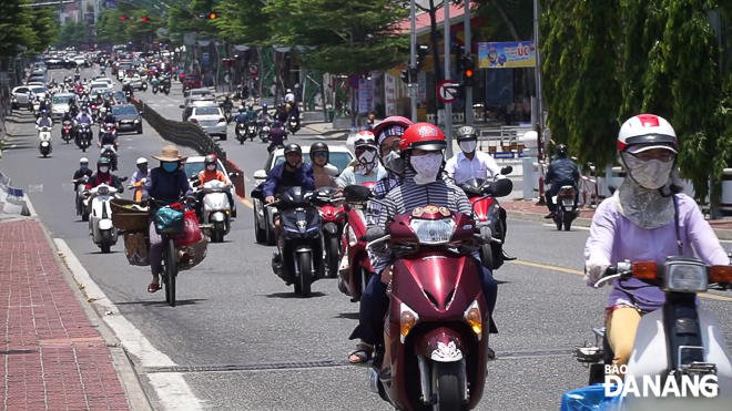 Most of motorcyclists riding on roads cover their body with anti-sun clothing to avoid sunlight. 