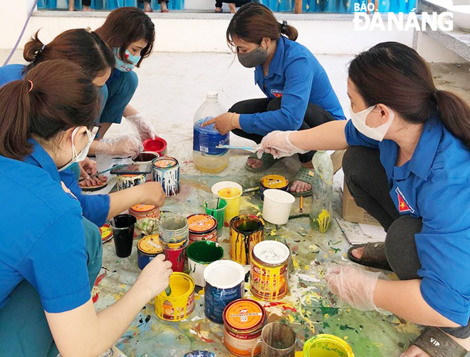 Teachers from the Binh Minh Preschool redecorating their school