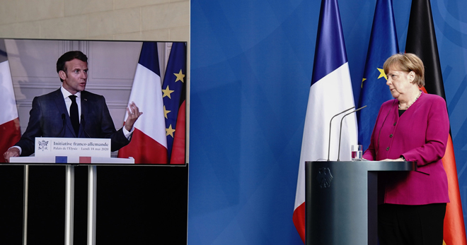 Trong cuộc họp trực tuyến ngày 18-5, Tổng thống Pháp Emmanuel Macron và Thủ tướng Đức Angela Merkel đề xuất gói cứu trợ trị giá 500 tỷ euro nhằm hỗ trợ trực tiếp cho các nước bị ảnh hưởng Covid-19 nghiêm trọng nhất trong EU. Ảnh: AFP/Getty Images