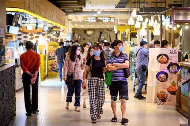 People wearing masks at a commercial central in Bangkok, Thailand. (Photo: AFP/VNA)