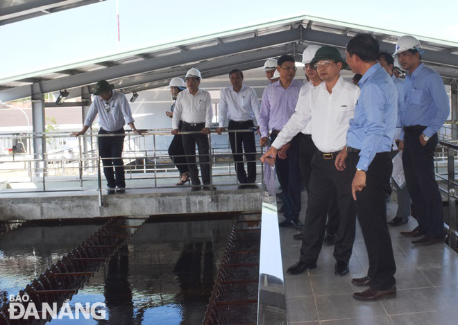 Deputy Secretary Quang (right, in dark green Vietnamese soldier’s hat) at the Hoa Trung Water Supply Plant