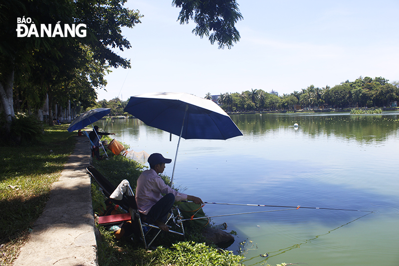 Local men going fishing in the 29 March Park to relax and beat the heat