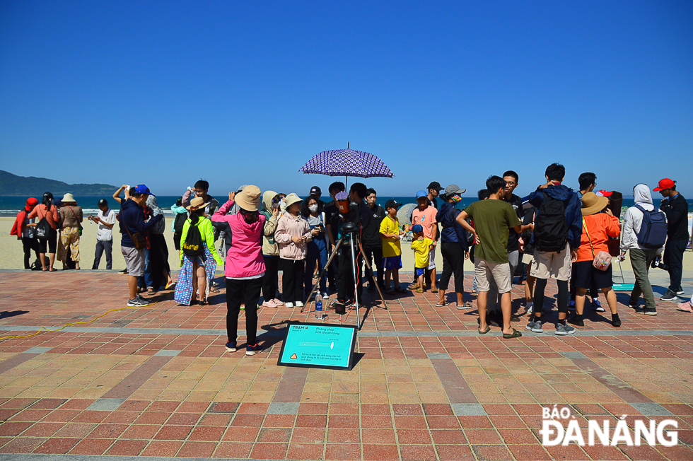 More than 100 skywatchers gathered at the East Sea Park on Sunday afternoon to witness the most dramatic “ring of fire” solar eclipse in years.