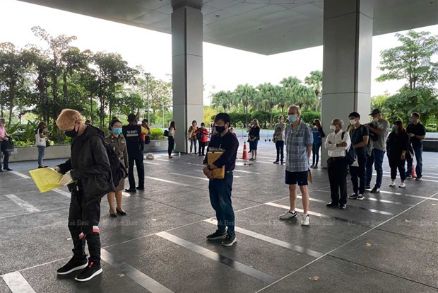 Foreigners wait at the Immigration Bureau's temporary office at the Central Investigation Bureau Building in Muang Thong Thani last week, seeking visa extensions after the COVID-19 pandemic disrupted their travel plans. (Photo: Thai Immigration Bureau)