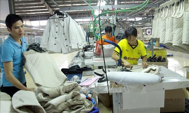 A Vietnamese company specialises in plastic packages and garment products for exports to the US (Photo: VNA)