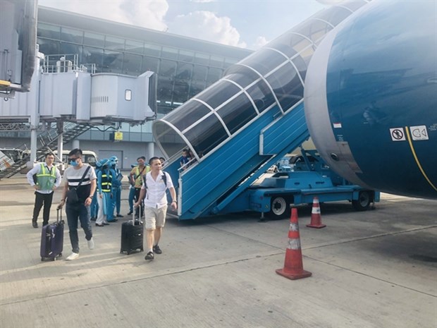 Passengers arrive at Tan Son Nhat airport in HCM City. Due to the current difficulties of the local aviation industry, no new airline is allowed to open until 2022 . (Photo: VNA)