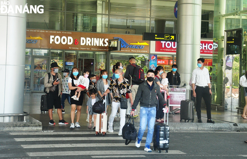 Tourists are seen arriving at the Da Nang airport