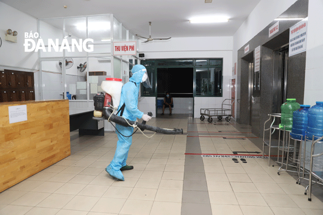 Spraying disinfectant inside the Da Nang General Hospital  